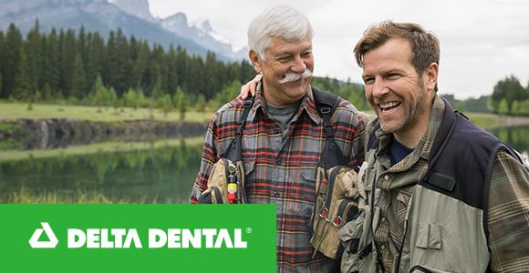 Deltal Dental, two men walking along a river talking and smiling.
