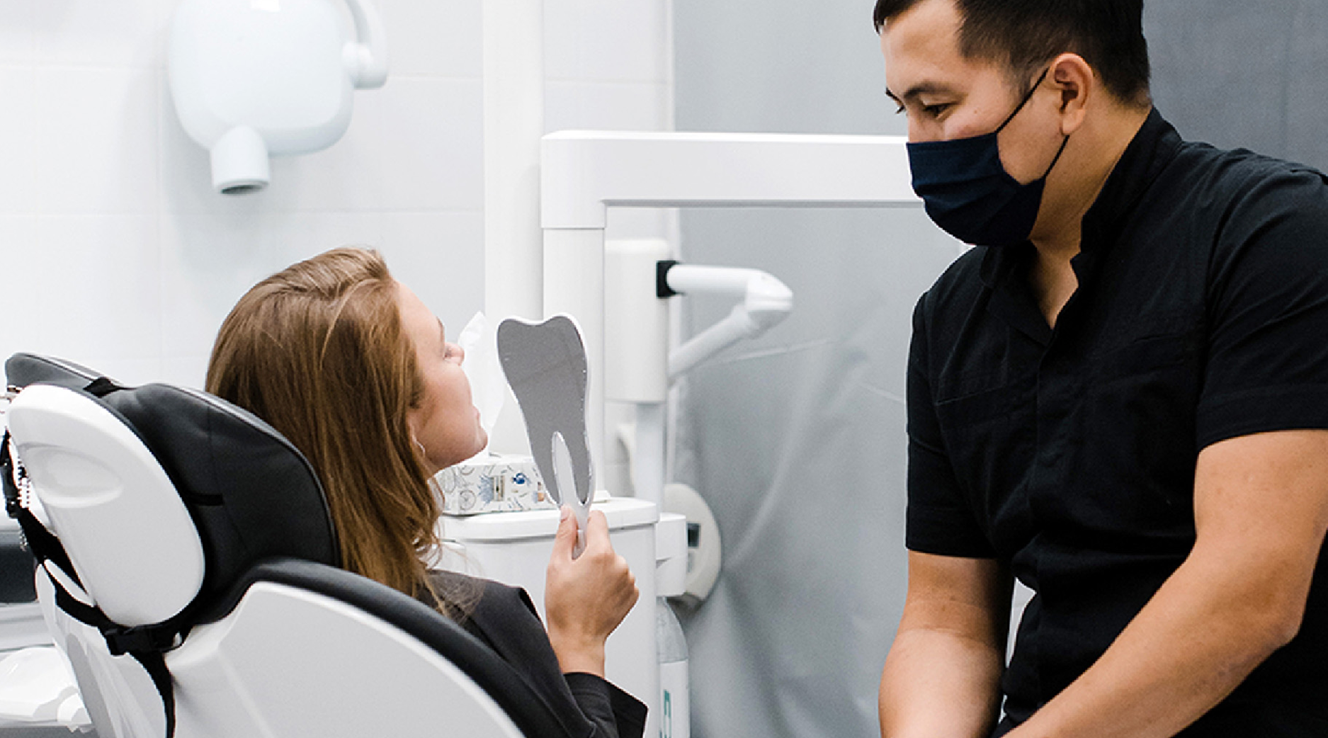 A patient looking at their teeth